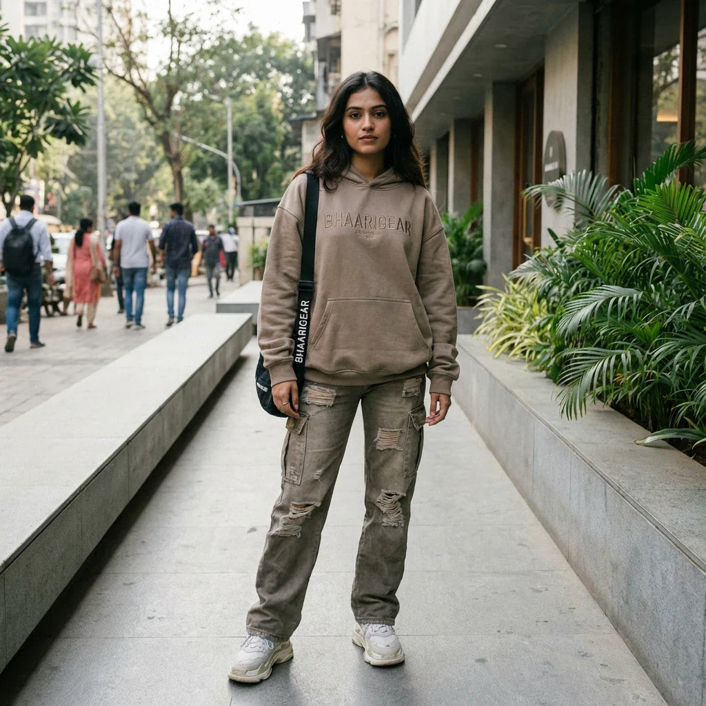 Indian female model wearing BhaariGear streetwear on a modern walkway, clean and stylish street-style look.