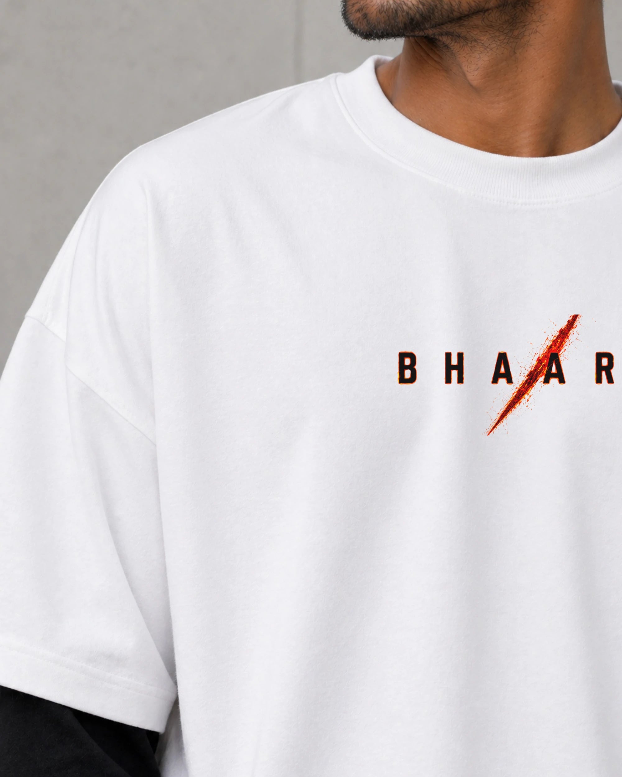 White t-shirt with 'BHAAR' logo on a gray background