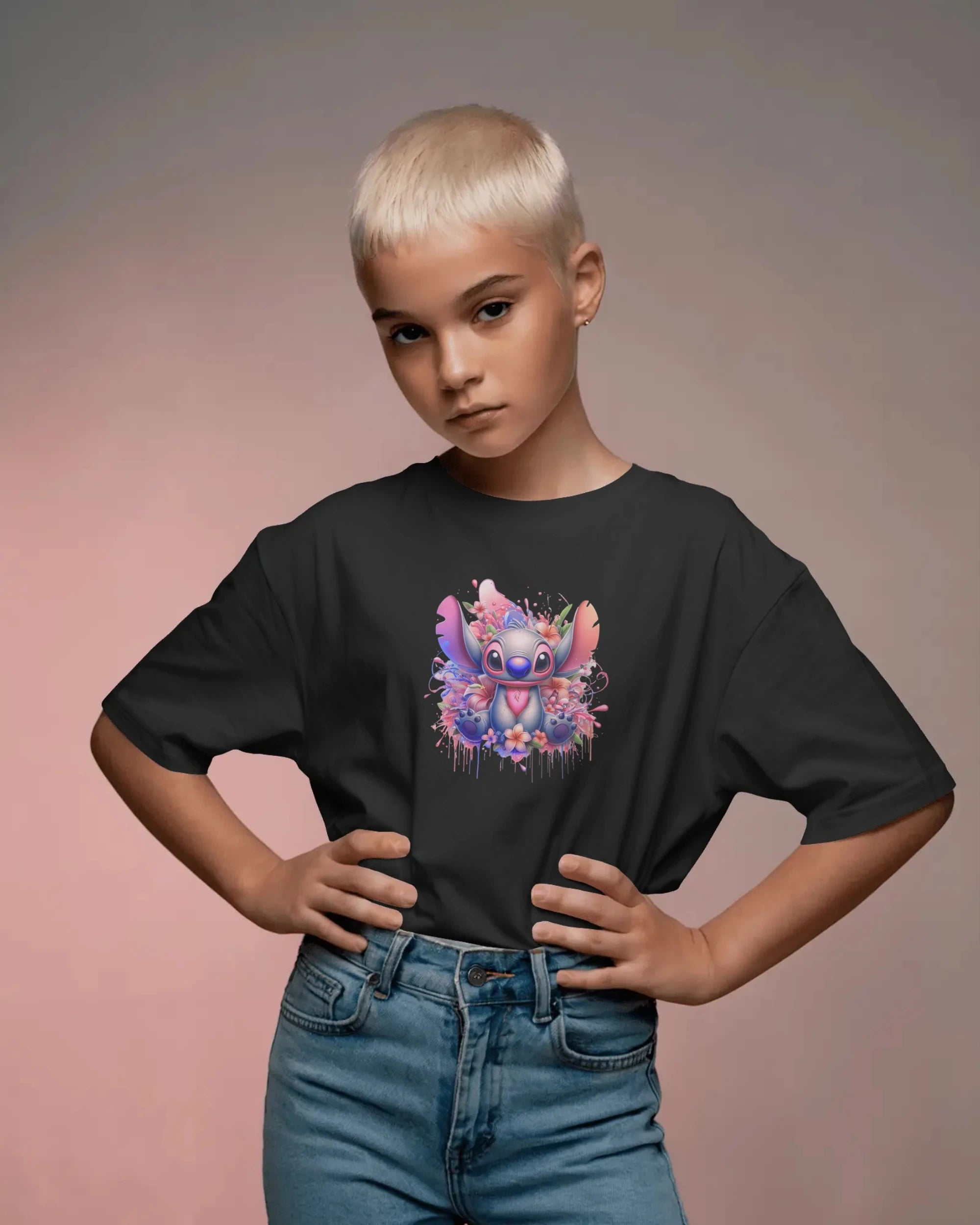 Child wearing a black t-shirt with a colorful character design on a gradient background