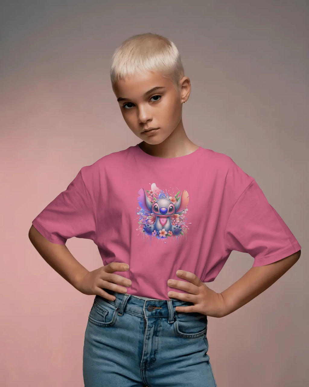 Child wearing a pink t-shirt with a cartoon character design on a plain background