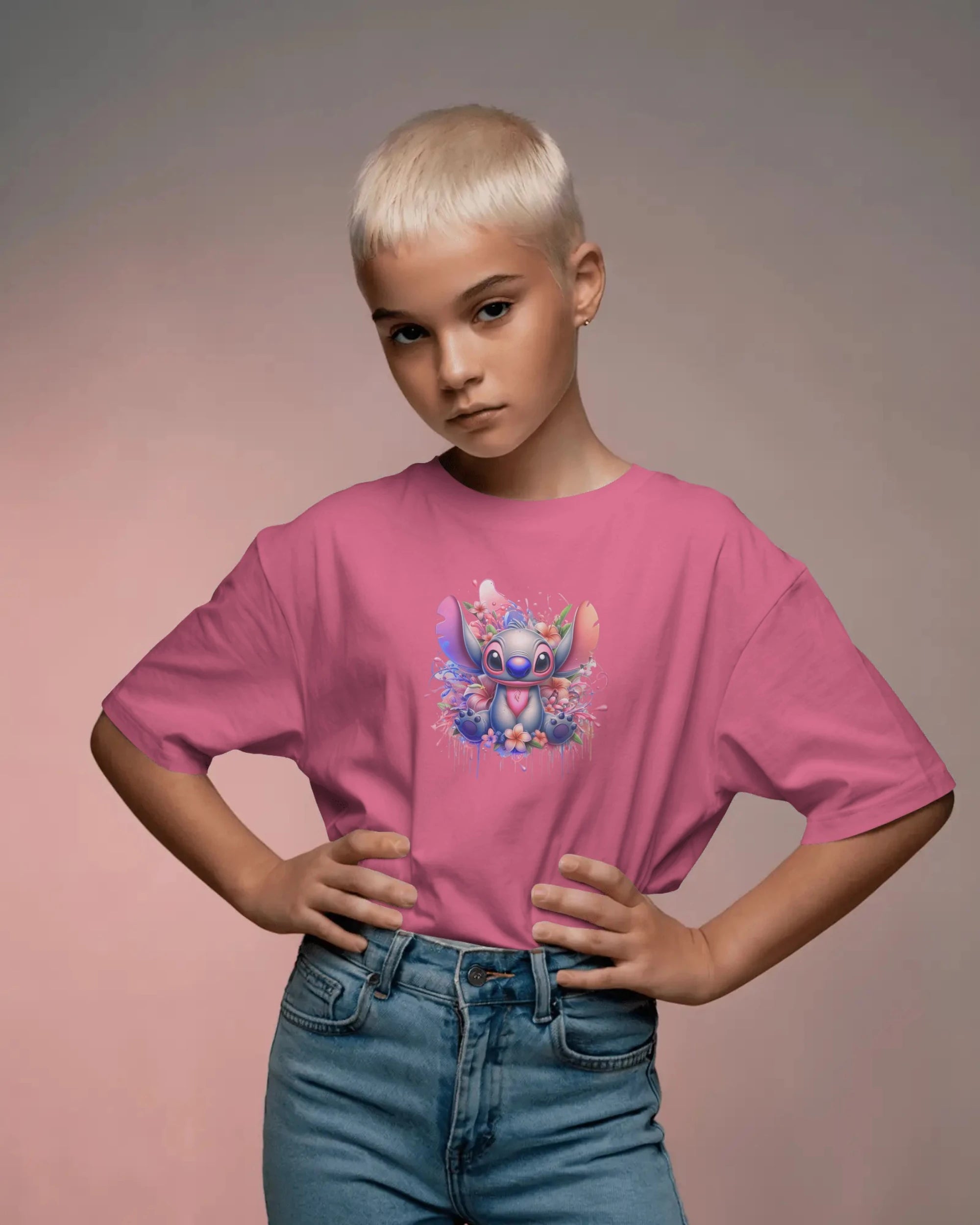 Child wearing a pink t-shirt with a cartoon character design on a plain background