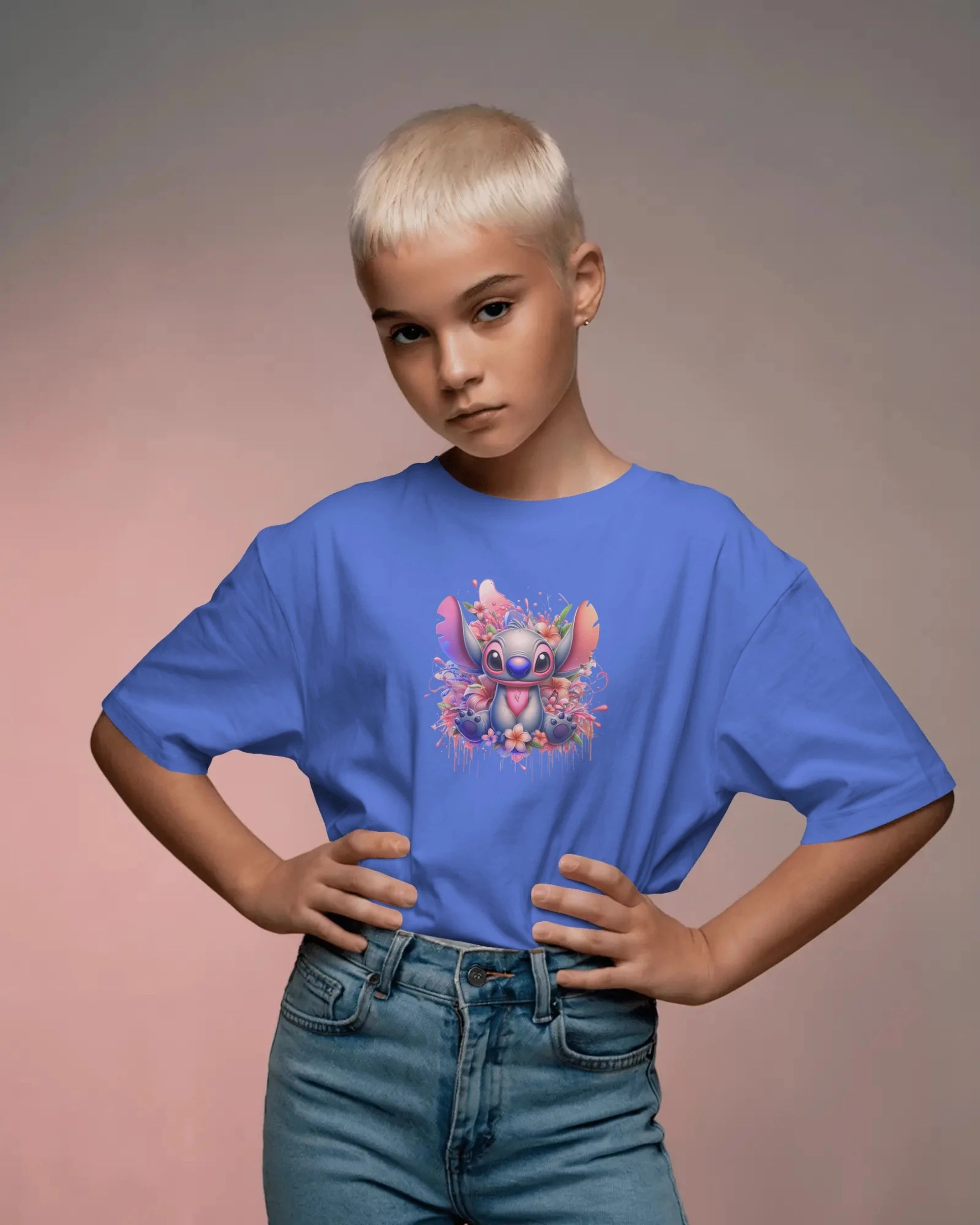 Child wearing a blue t-shirt with a colorful design on a gradient background