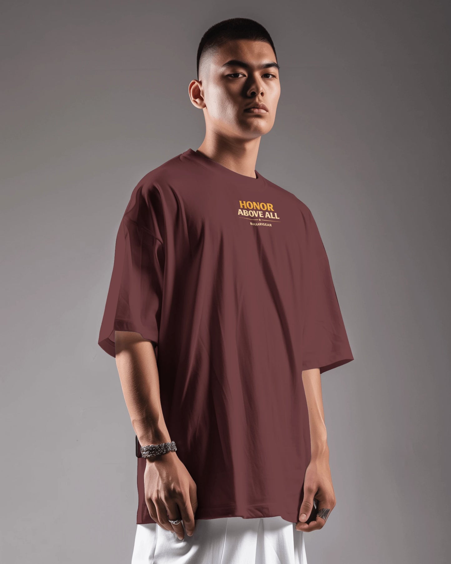 Maroon oversized T-shirt by BhaariGear featuring "Honor Above All Warrior Legacy" graphic on front, casual fit, front side view.