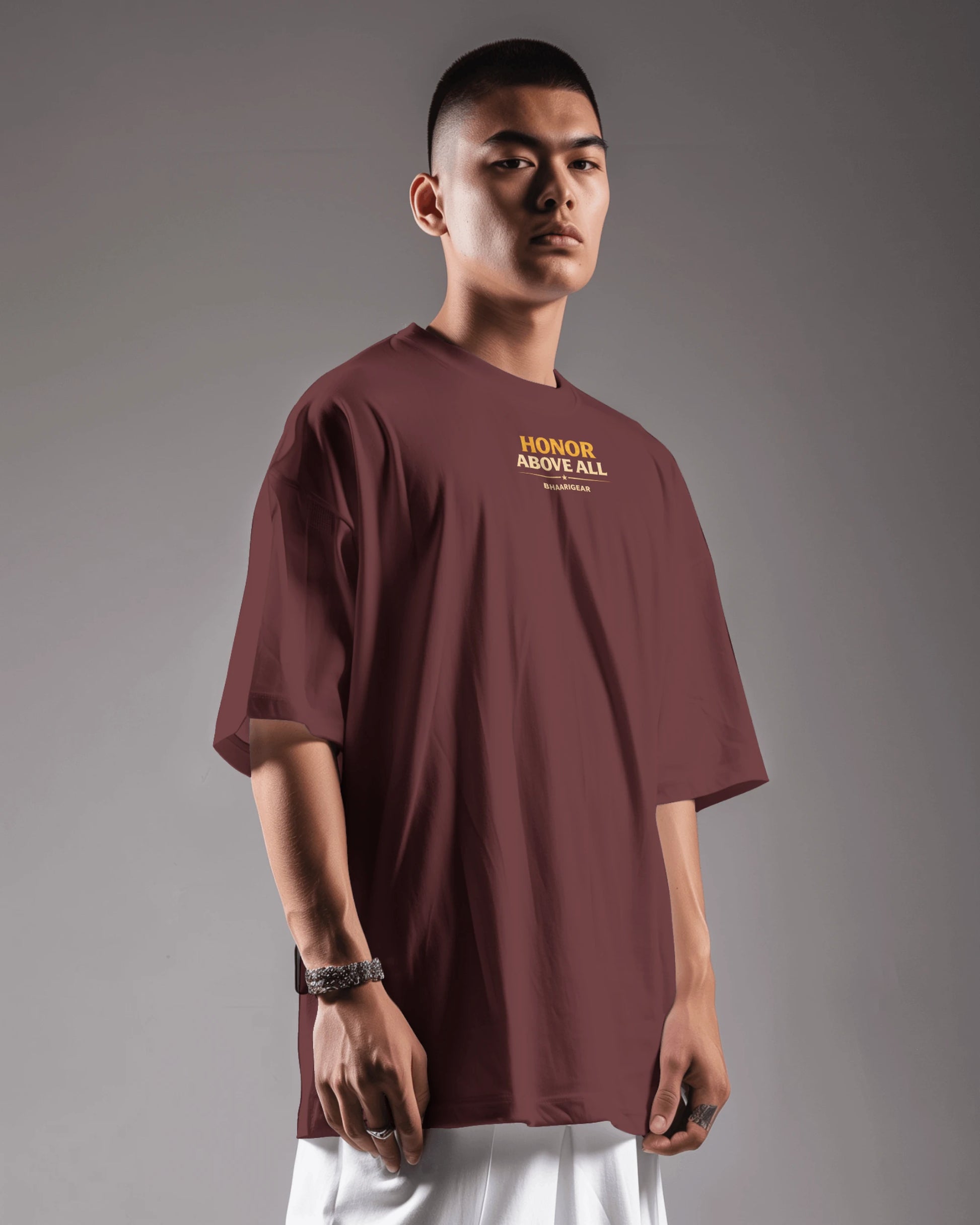 Maroon oversized T-shirt by BhaariGear featuring "Honor Above All Warrior Legacy" graphic on front, casual fit, front side view.