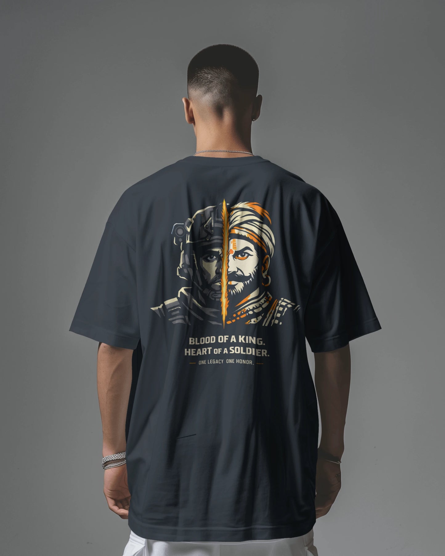 Back view of navy blue Kings Blood Legacy graphic oversized T-shirt by BhaariGear featuring bold print on the front.