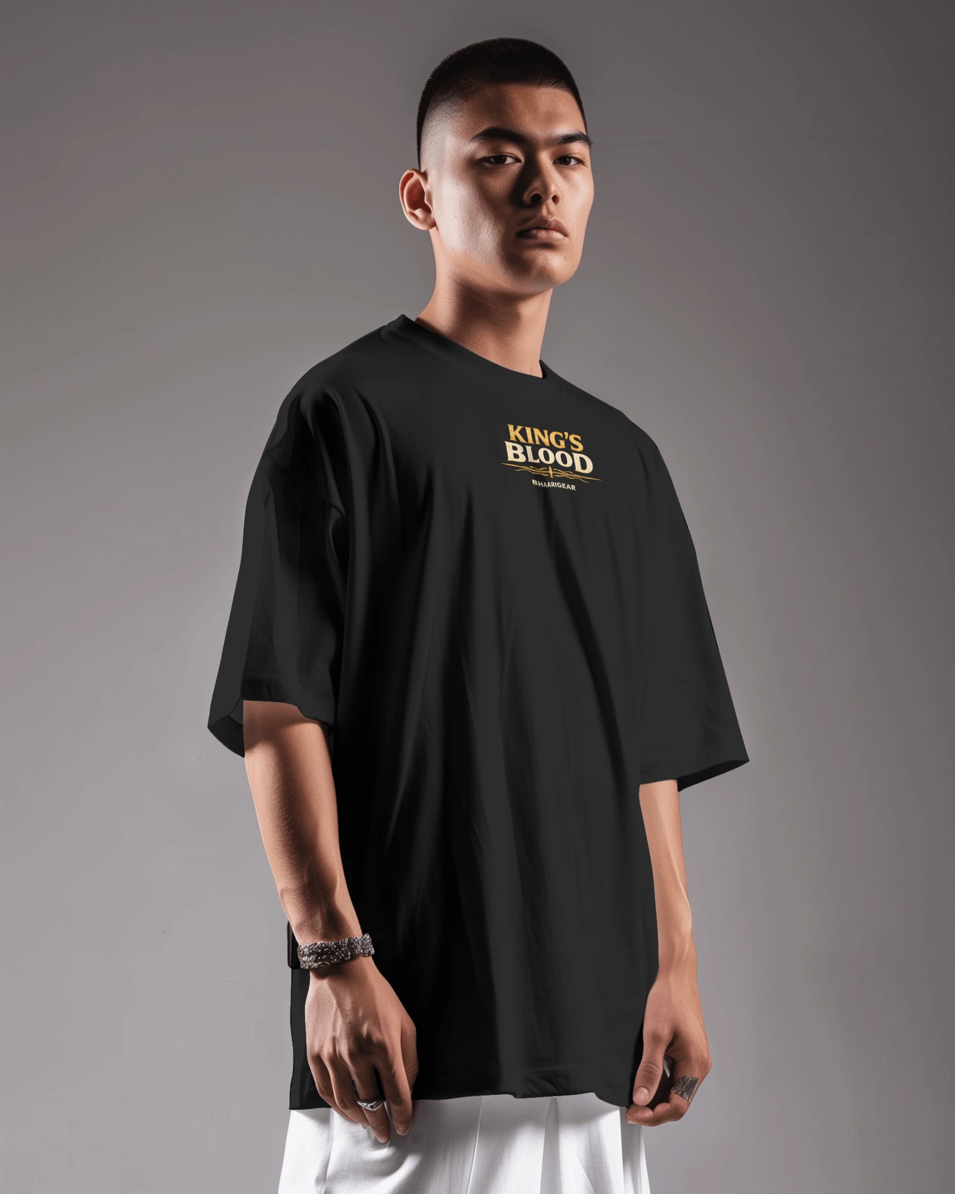 Black Kings Blood Legacy graphic oversized T-shirt by BhaariGear, showing a left side view with detailed design and relaxed fit.