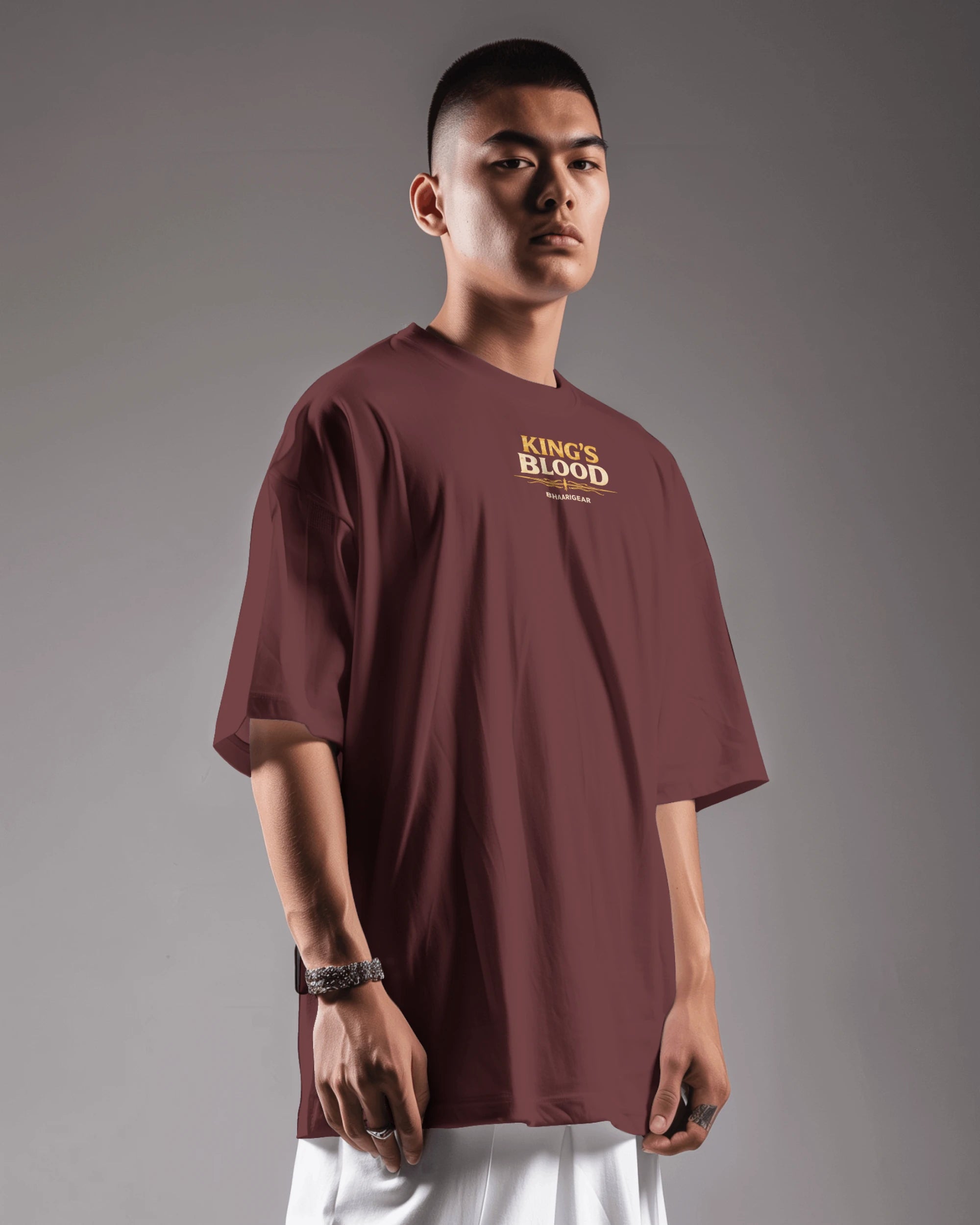 Maroon Kings Blood Legacy graphic oversized T-shirt by BhaariGear, left side view showing bold design and relaxed fit.