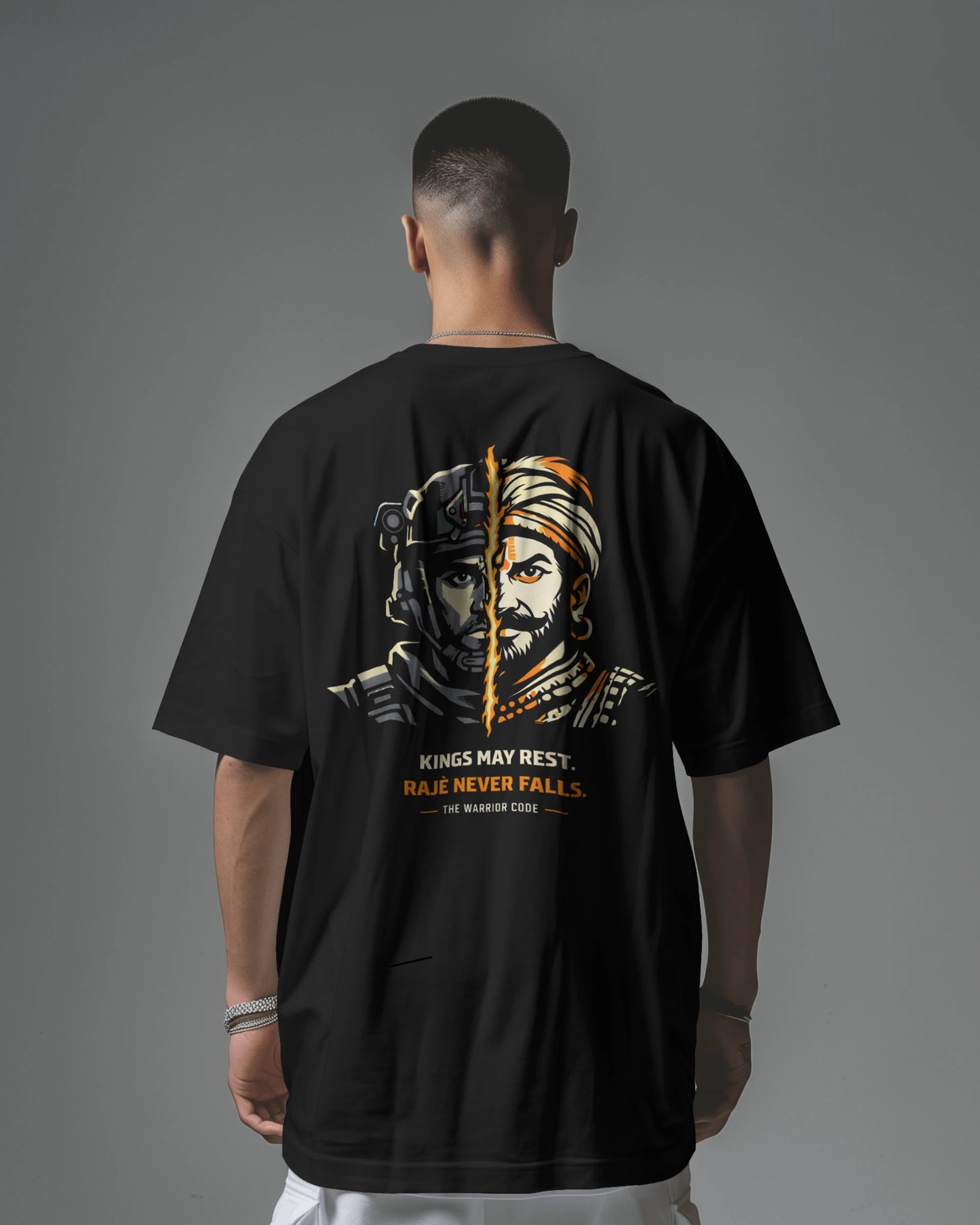 Back view of BhaariGear Never Fall Warrior Legacy oversized T-shirt in black, featuring bold graphic design on the front.