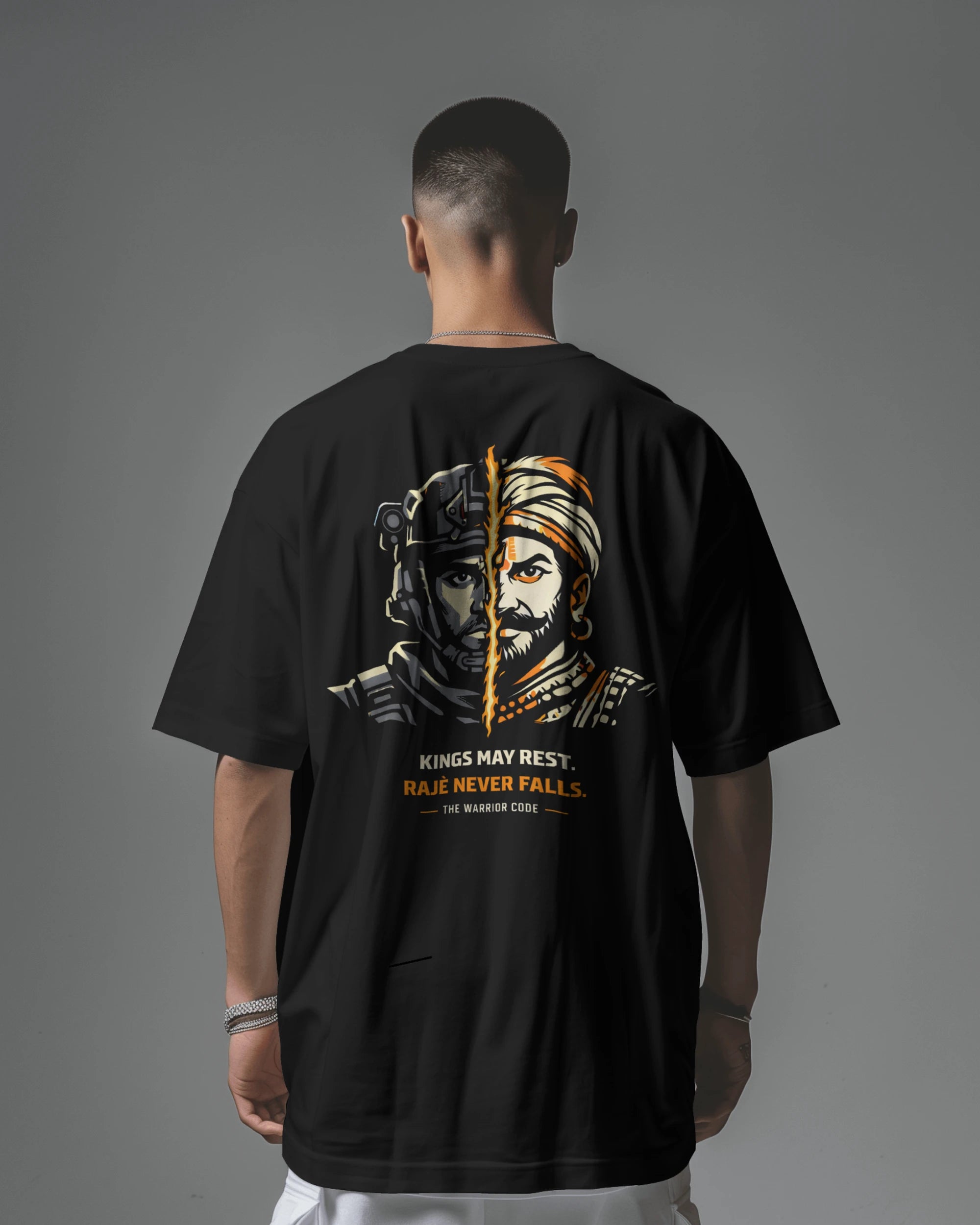Back view of BhaariGear Never Fall Warrior Legacy oversized T-shirt in black, featuring bold graphic design on the front.