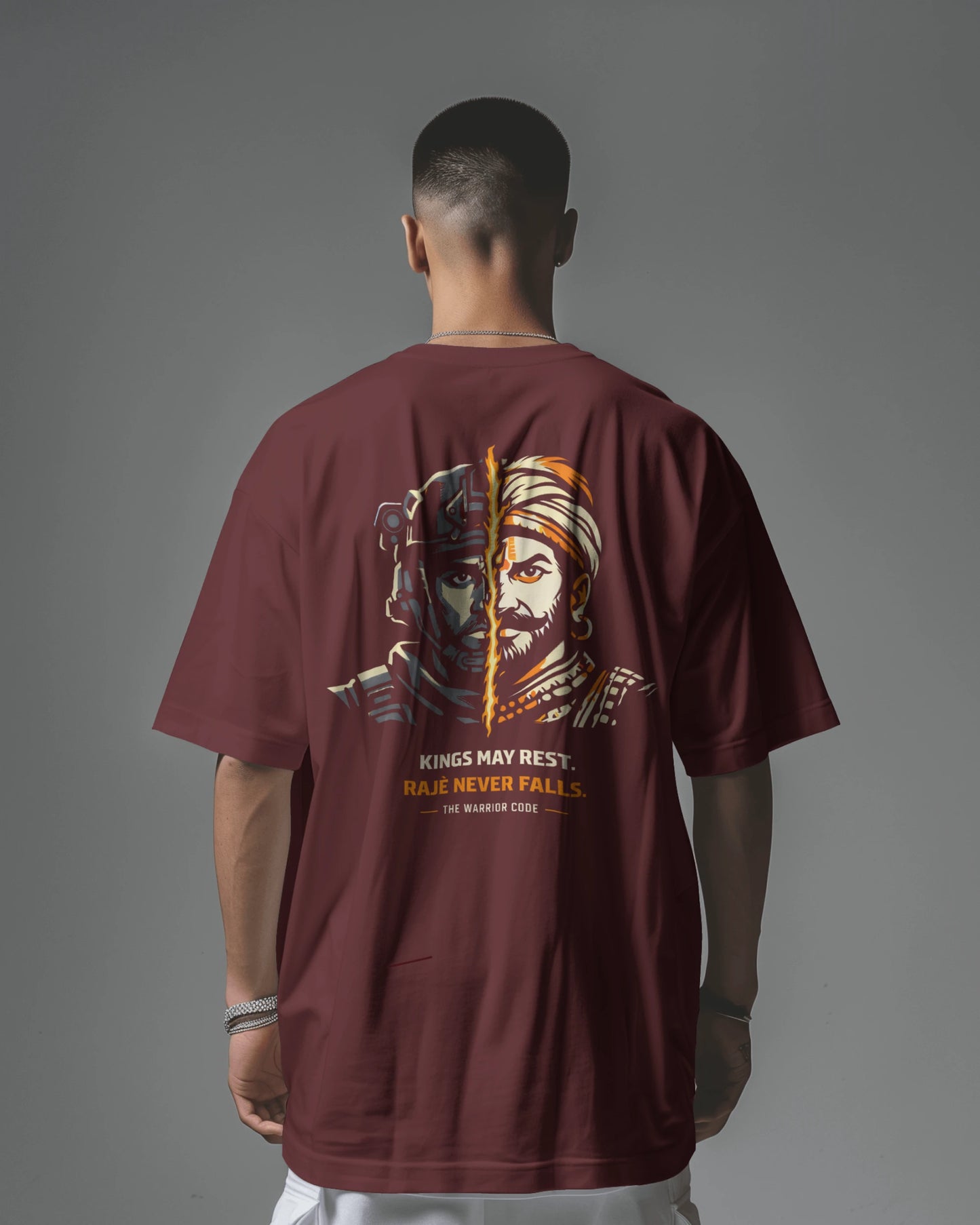 Back view of BhaariGear Never Fall Warrior Legacy oversized T-shirt in maroon showing the bold graphic design on the back.