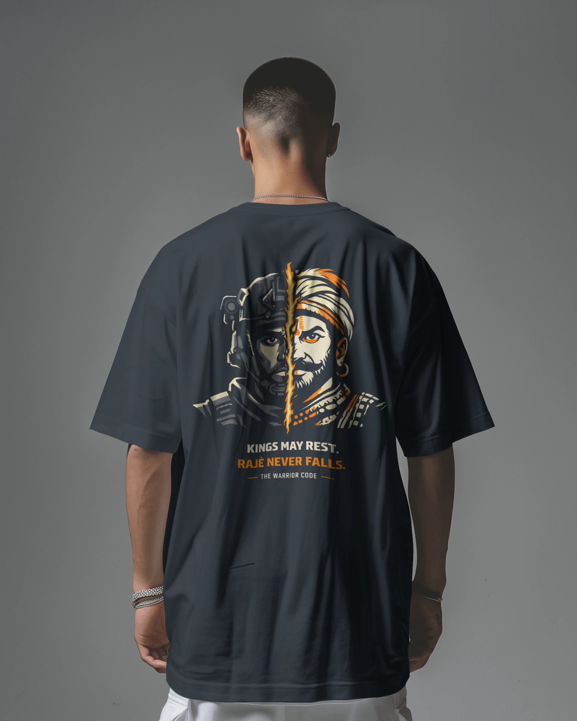 Back view of navy blue BhaariGear Never Fall Warrior Legacy oversized T-shirt with bold front graphic design.