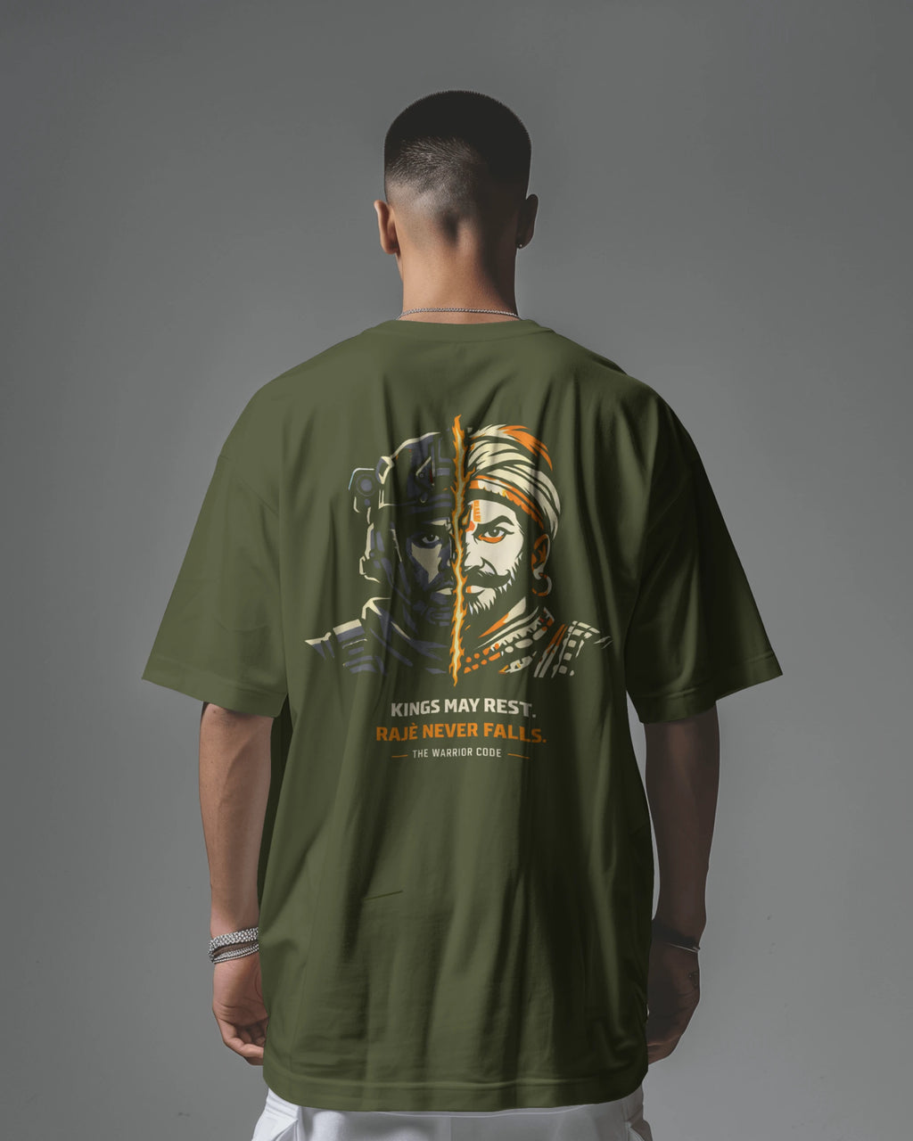 Back view of BhaariGear Never Fall Warrior Legacy oversized T-shirt in olive green, featuring bold graphic design on the back.