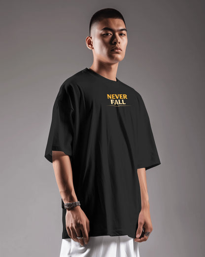 Black Never Fall Warrior Legacy oversized T-shirt by BhaariGear, front view showcasing bold graphic and relaxed fit.