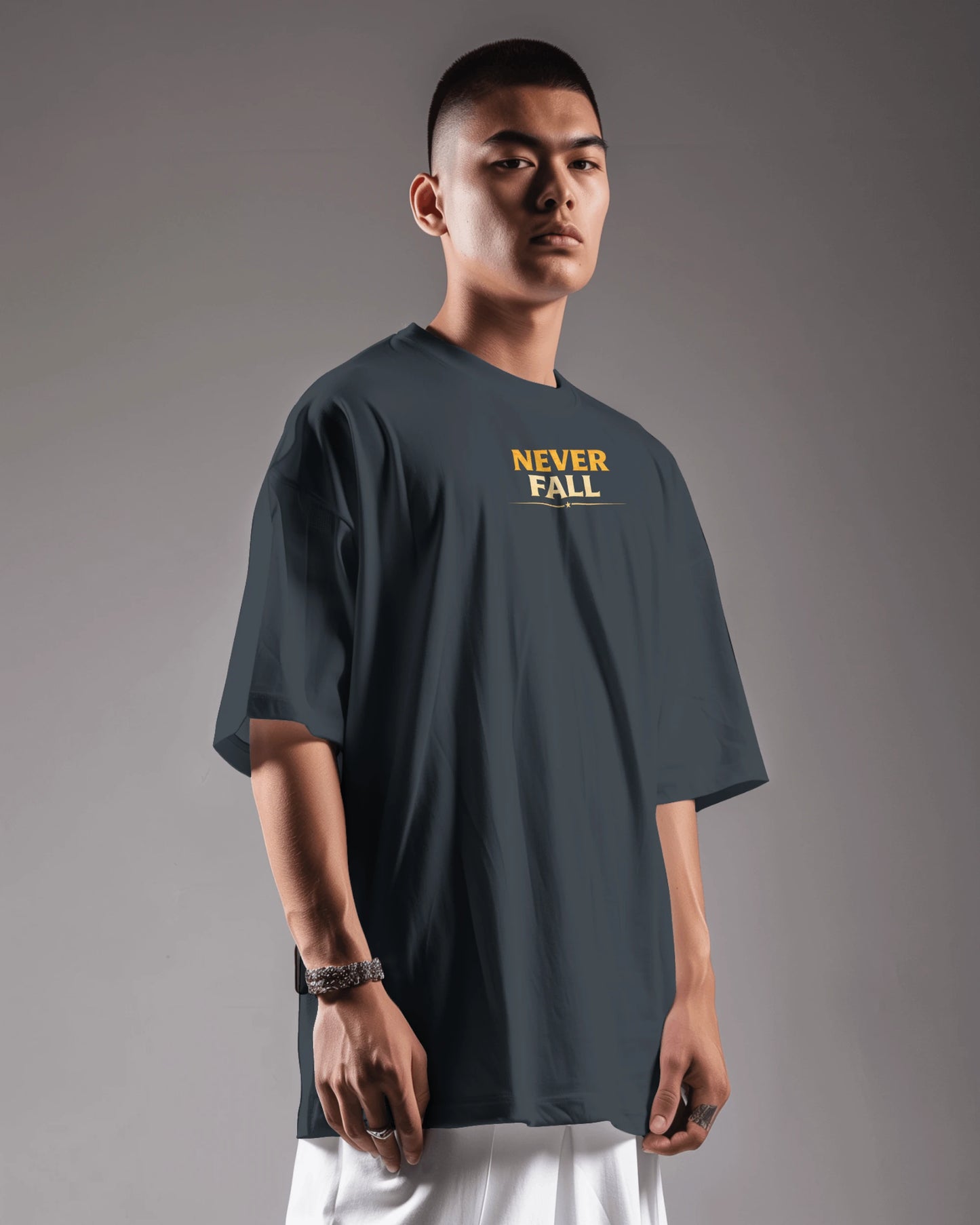 Navy blue Never Fall Warrior Legacy oversized T-shirt by BhaariGear, front view showing bold graphic design and relaxed fit.