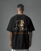 Back view of black BhaariGear Raje Lives Warrior oversized graphic T-shirt with bold front design and comfortable fit.