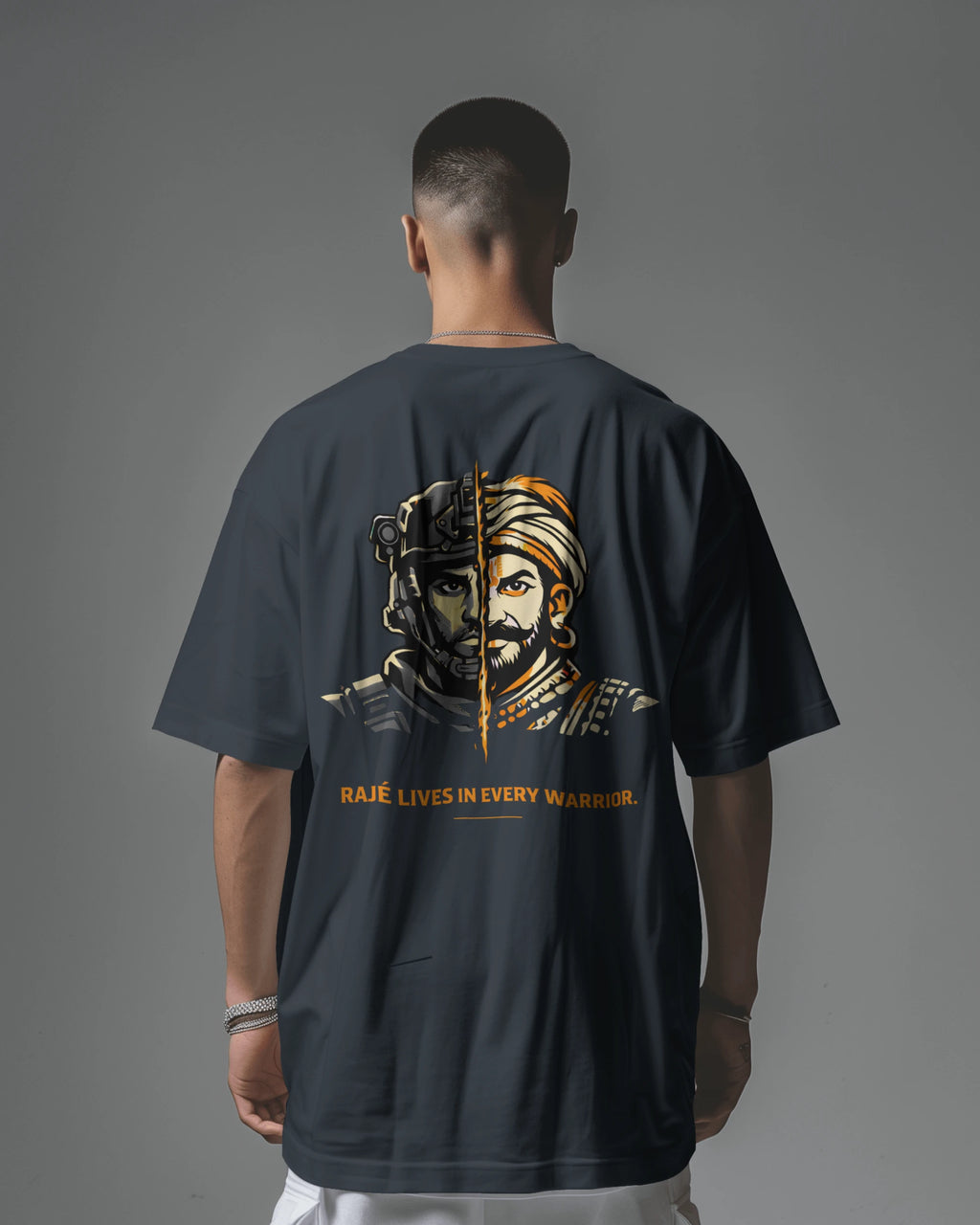 Back view of navy blue Raje Lives Warrior oversized graphic T-shirt by BhaariGear, featuring bold warrior artwork on the front.