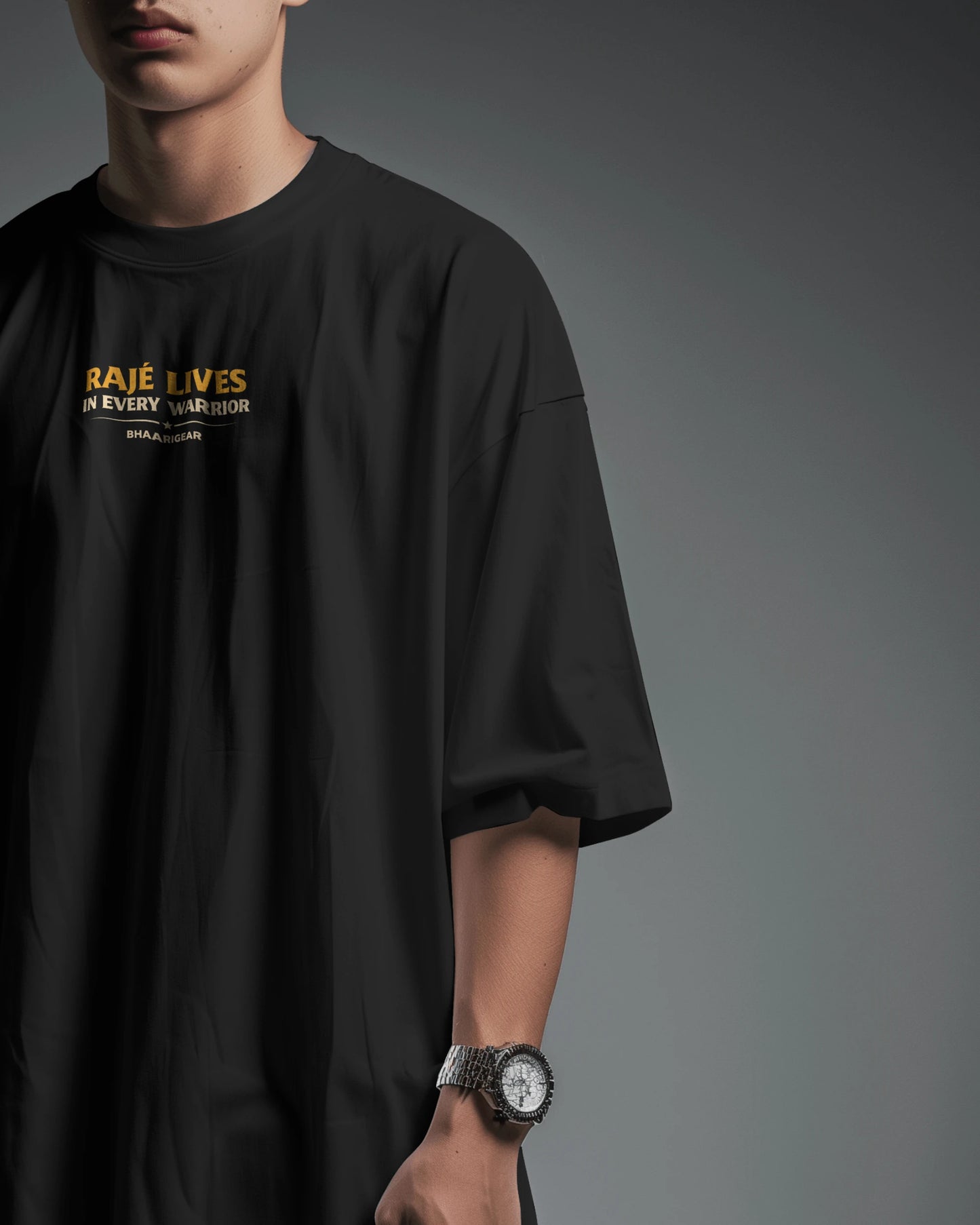 Black BhaariGear Raje Lives Warrior oversized graphic T-shirt shown from front half-side view.