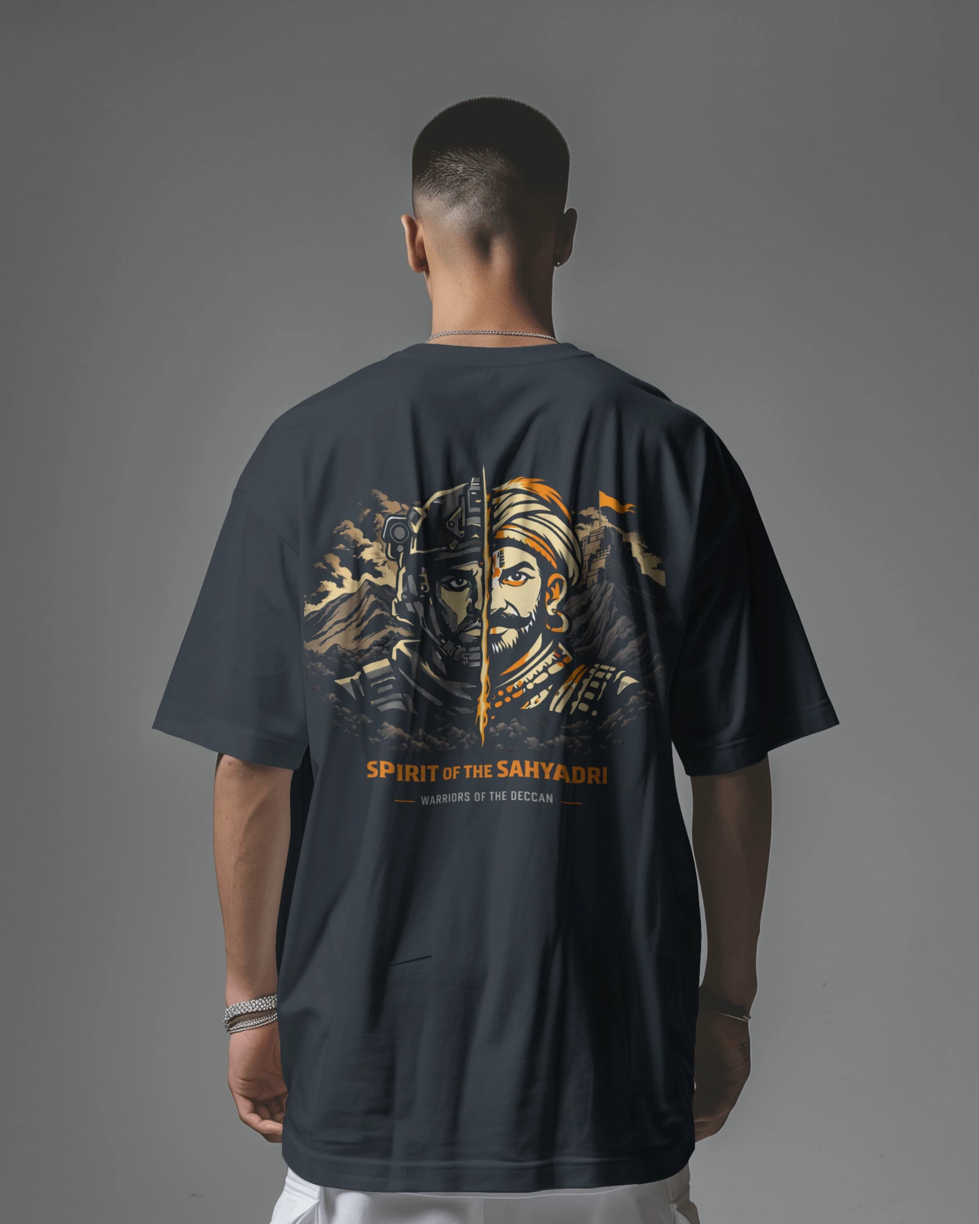 Asian model wearing BhaariGear Sahyadri Spirit Warrior oversized T-shirt, showcasing its relaxed fit and bold graphic design.