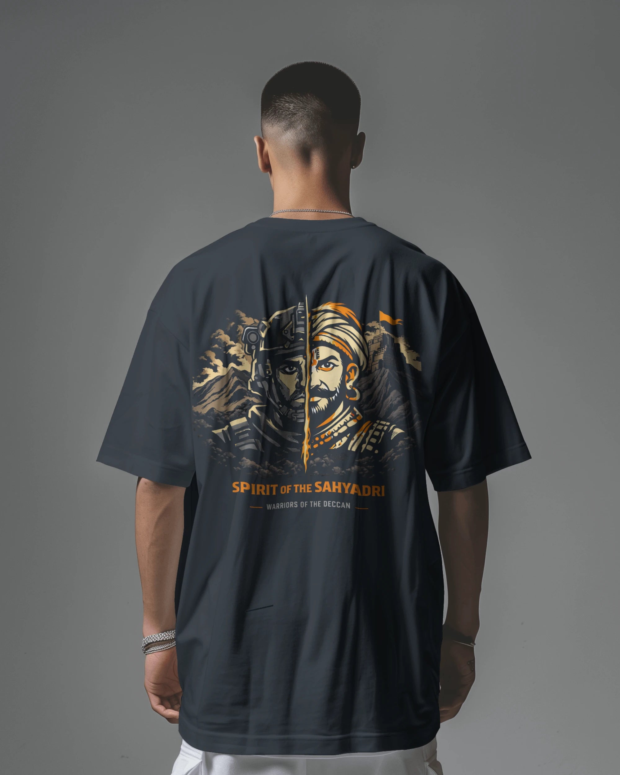 Asian model wearing BhaariGear Sahyadri Spirit Warrior oversized T-shirt, showcasing its relaxed fit and bold graphic design.