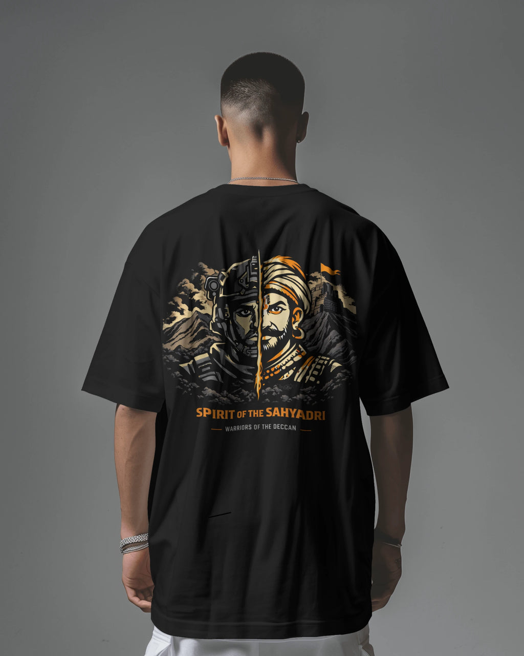 Asian model wearing BhaariGear Sahyadri Spirit Warrior oversized T-shirt, showcasing its relaxed fit and bold graphic design.