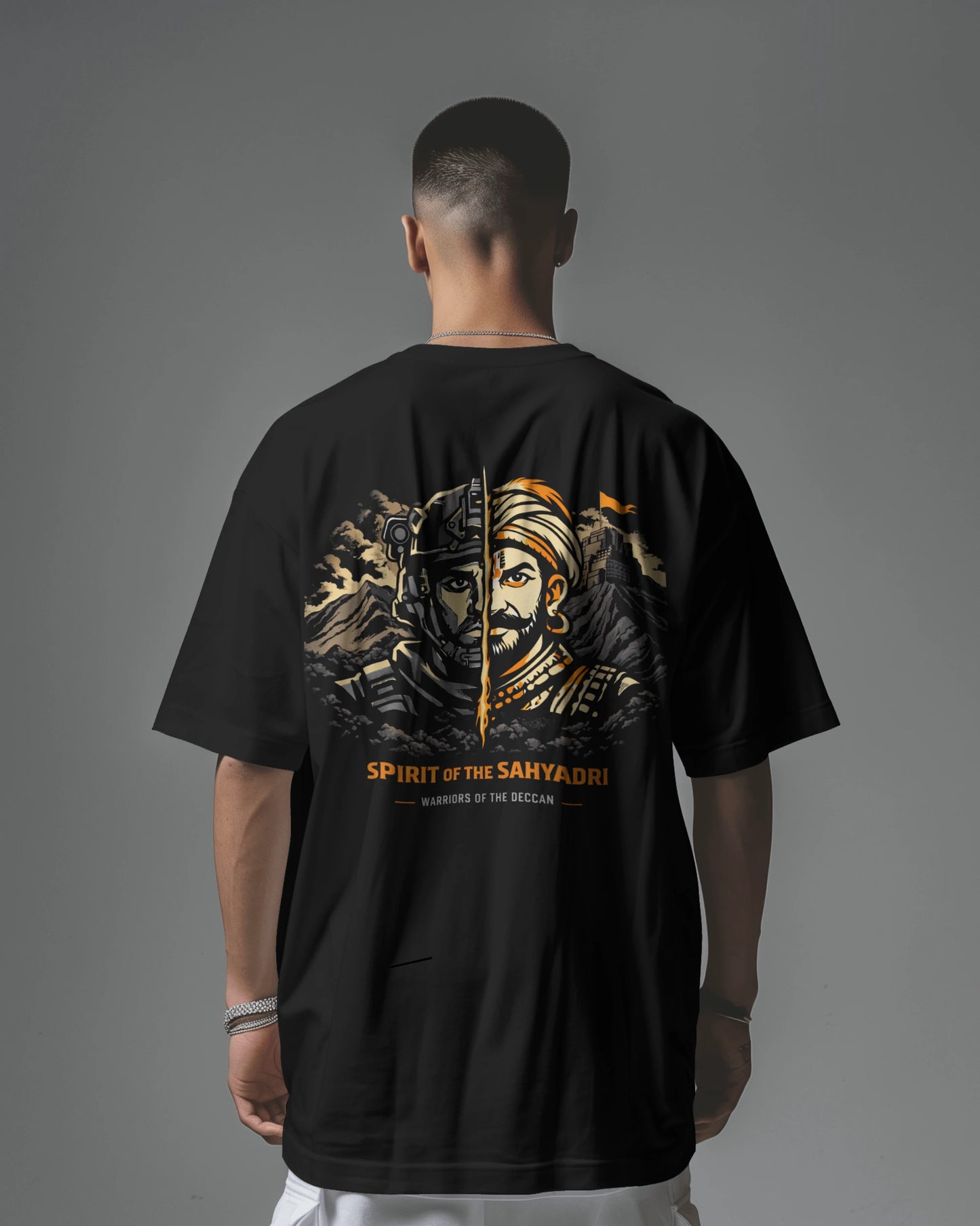Asian model wearing BhaariGear Sahyadri Spirit Warrior oversized T-shirt, showcasing its relaxed fit and bold graphic design.