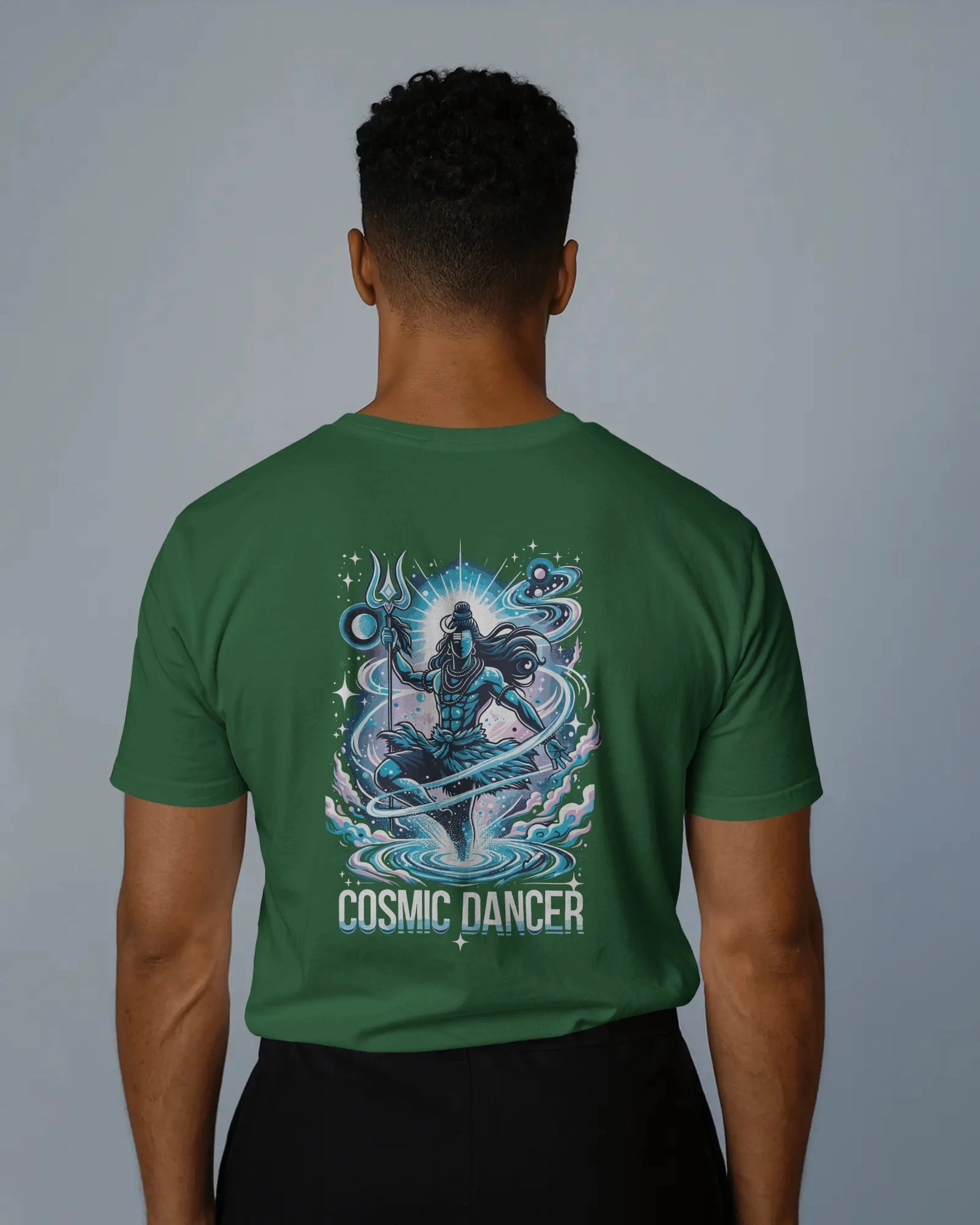 Person wearing a Bootle green t-shirt with 'Cosmic Dancer' design on the back against a gray background