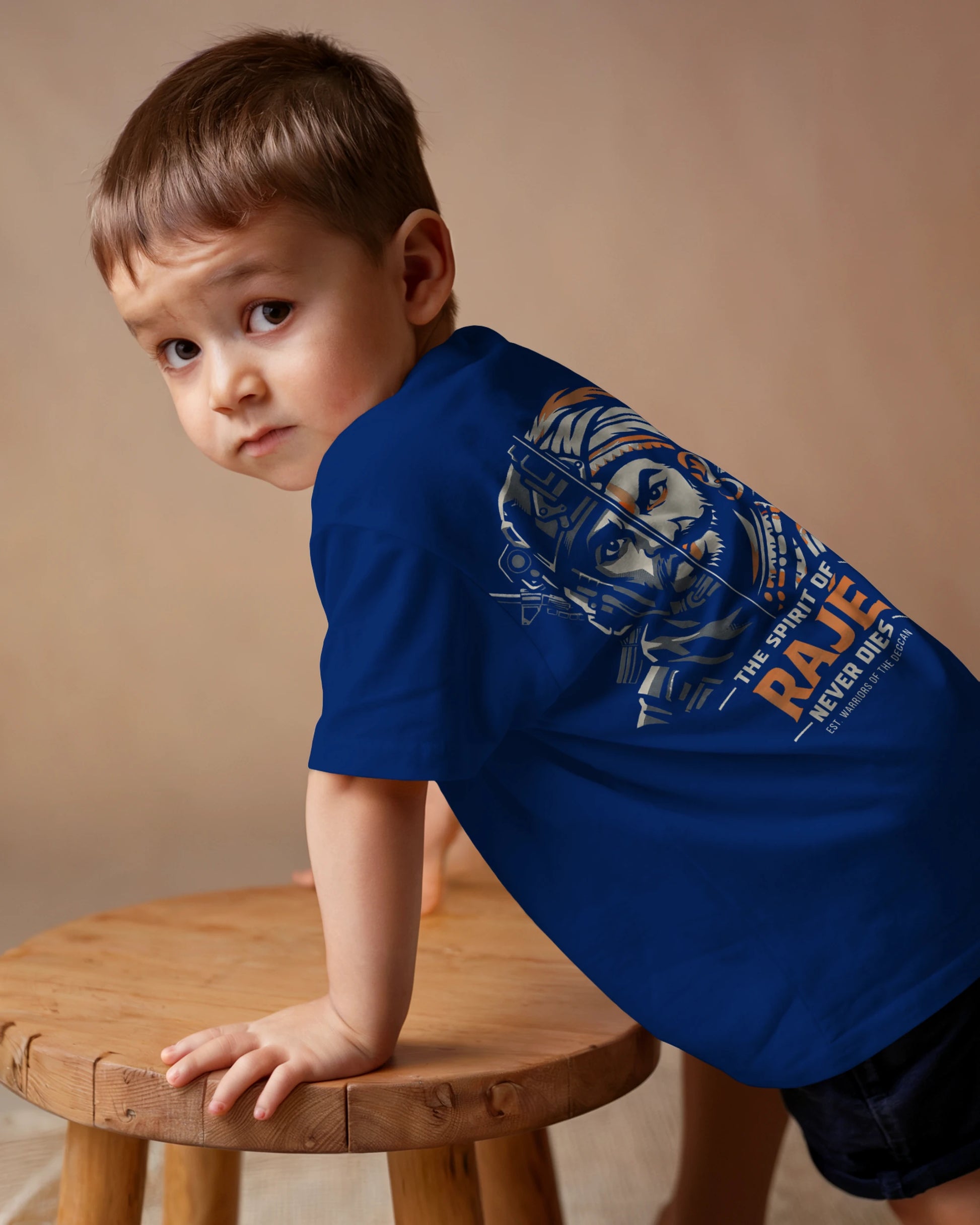 Royal blue Spirit of Raje Kids T-Shirt by BhaariGear featuring a warrior legacy design, back view of the children's casual t-shirt.
