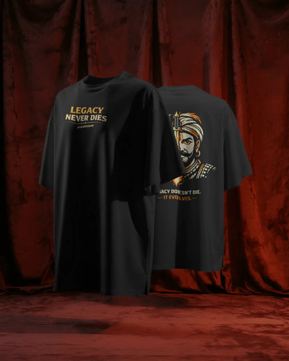 Black t-shirt with graphic design and text on a red curtain background