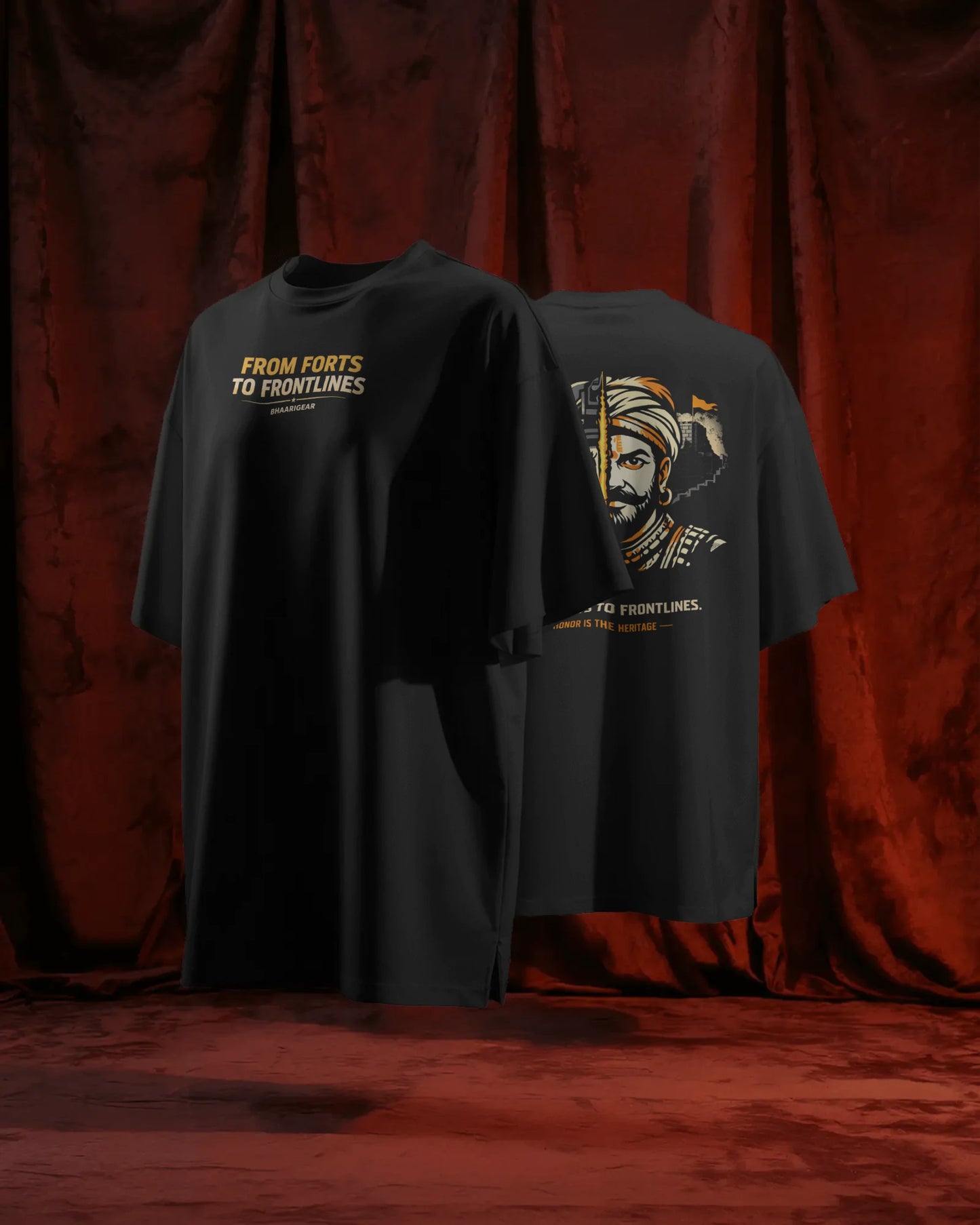 Maratha Warrior oversized streetwear T-shirt by BhaariGear, front and back view on a floating stand with rich red curtains.