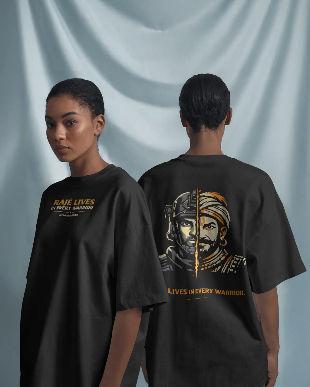 Female model wearing BhaariGear Raje Lives Warrior oversized graphic T-shirt, front and back views against soft draped fabric background.