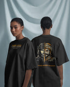 Female model wearing BhaariGear Raje Lives Warrior oversized graphic T-shirt, front and back views against soft draped fabric background.