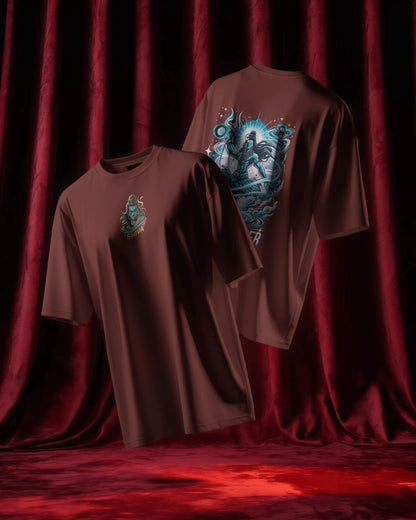 Two brick red t-shirts with graphic designs on a red curtain background