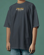 Person wearing a dark Navy blue Oversize  t-shirt  with front text desing 