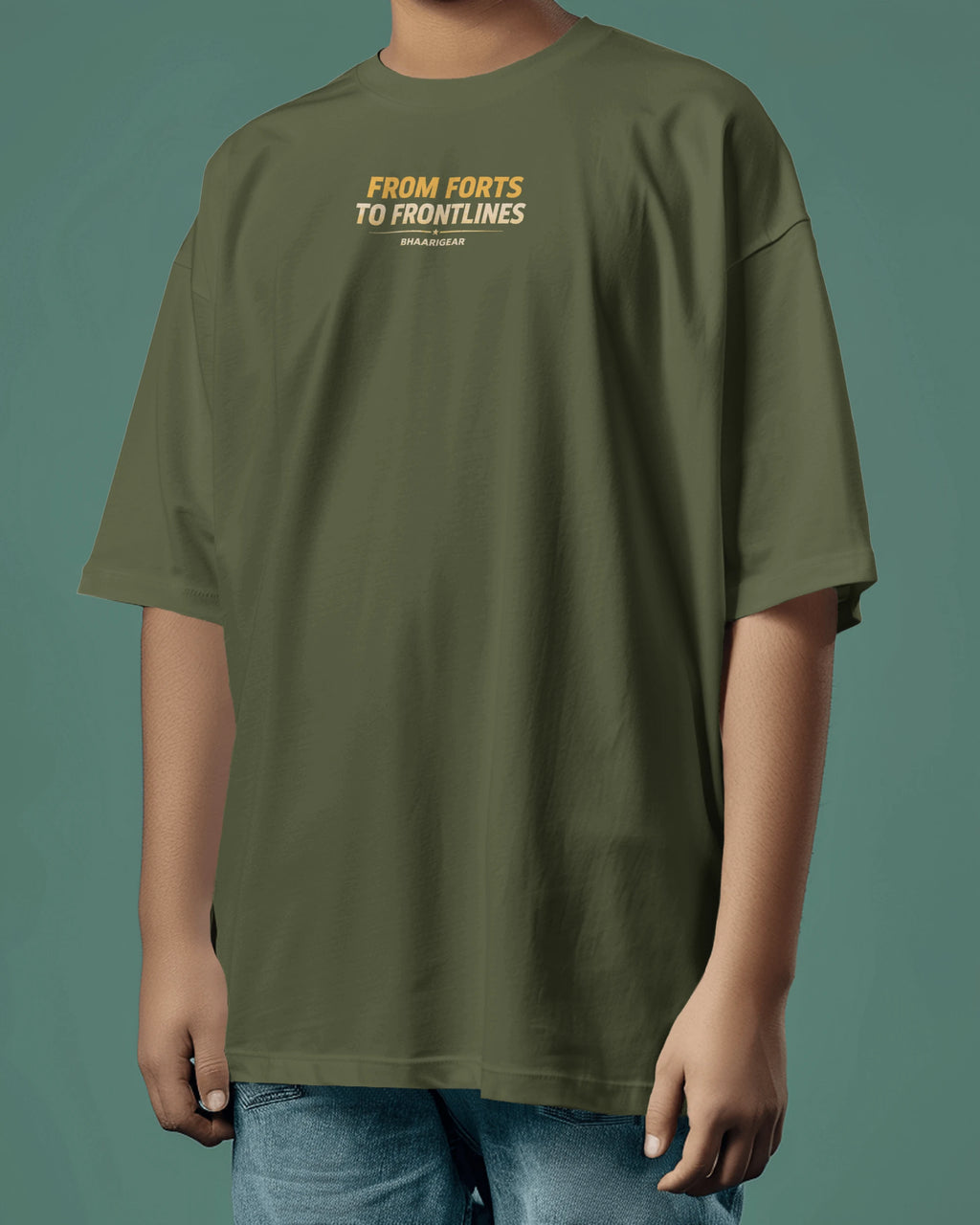 Person wearing a  olive green t-shirt with text on a solid background