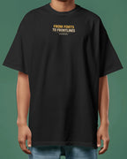 Black t-shirt with text 'From Forts to Frontlines' on a green background