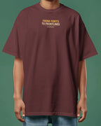 Maroon t-shirt with text 'FROM FORTS TO FRONTLINES' on front of Oversize t-Shirt front side