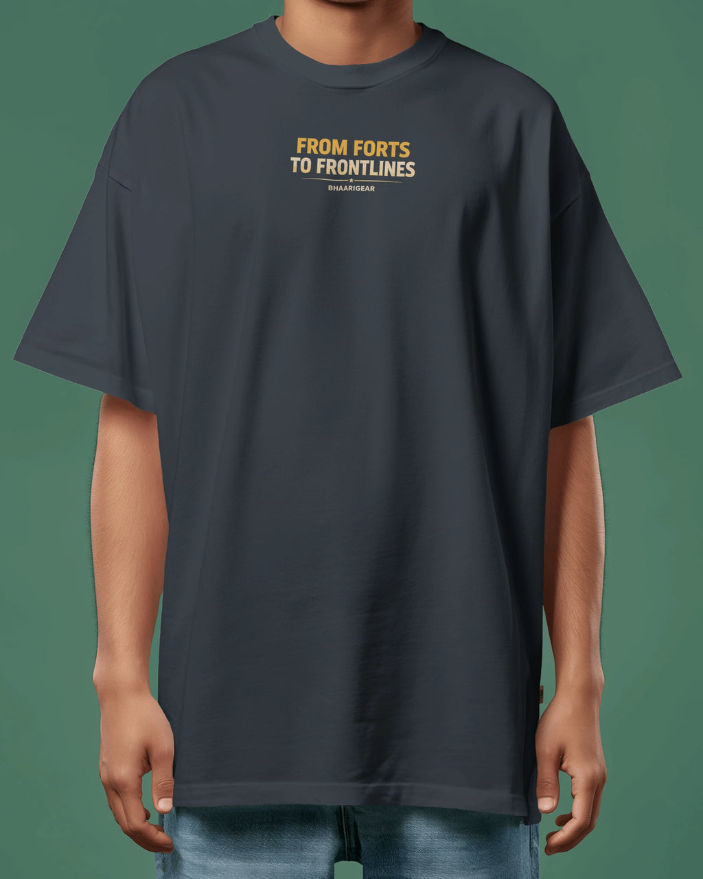 Person wearing a navy blue t-shirt with text on a green background