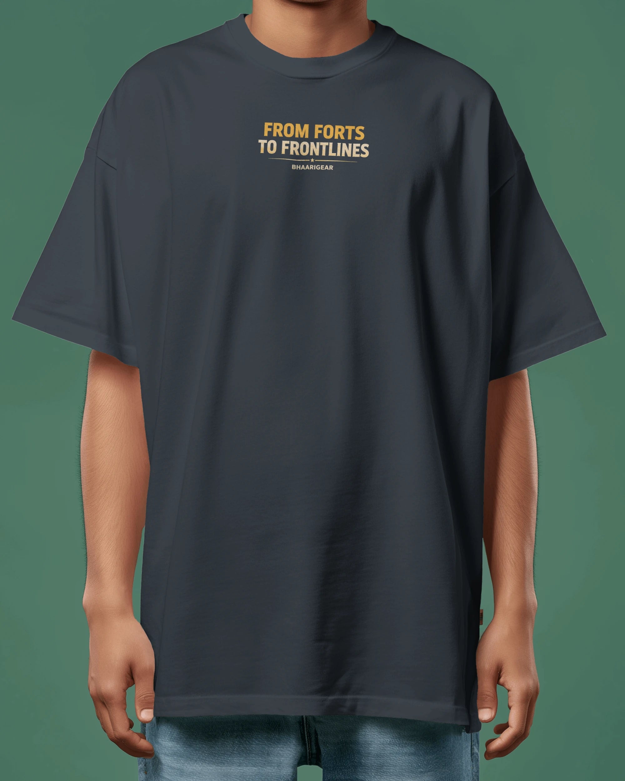 Person wearing a navy blue t-shirt with text on a green background