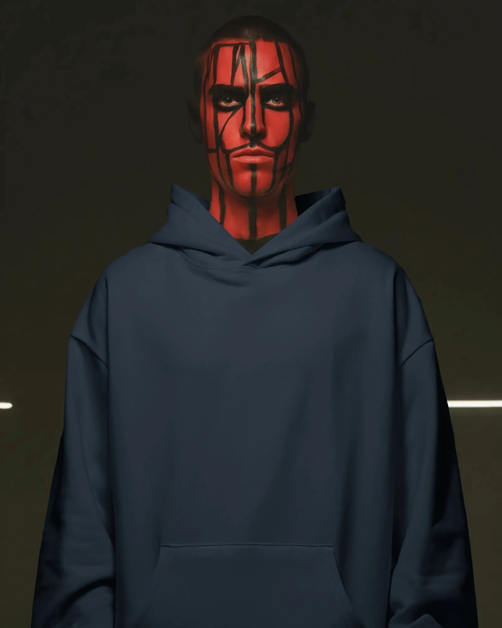 Person wearing a navy blue pullover hoodie with red face paint against a dark background