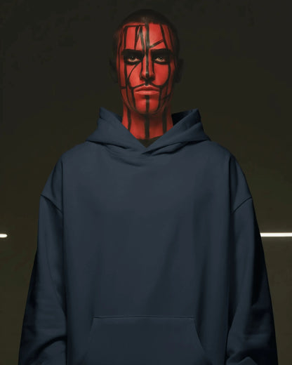 Person wearing a navy blue pullover hoodie with red face paint against a dark background