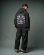 Person wearing a black pulloverhoodie with 'Shivay' design on the back against a gray background